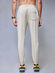 Beige branded tape joggers CAVA athleisure